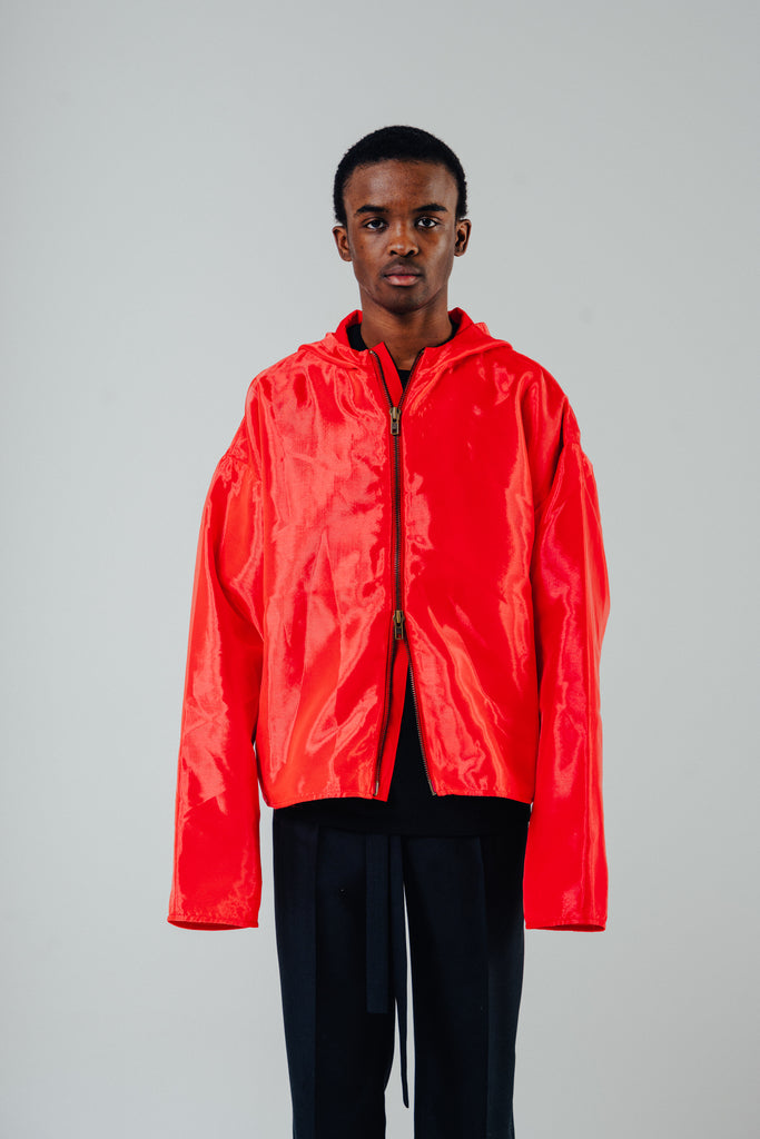 flame red organza jacket featuring a boxy oversized fit and cropped body, modeled by a man wearing a size small.