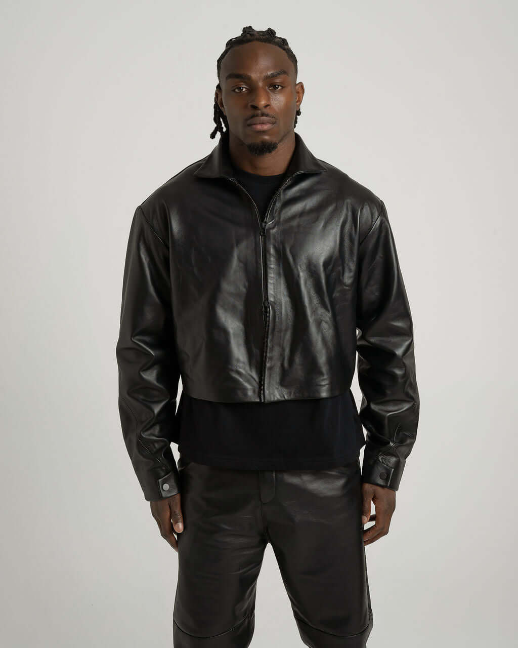 Cropped zipped black leather jacket on model, showcasing soft Suave Napa leather and stylish boxy fit.
