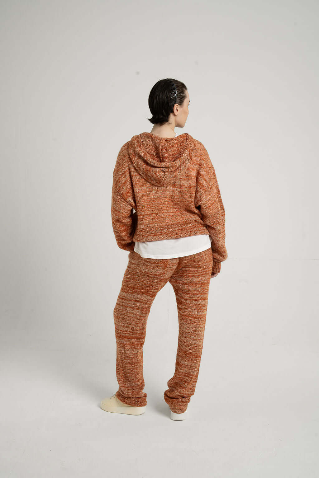 Model wearing oversized Kid Mohair Blend Knitted Hoody in Evening Sun, showcasing unique knitted texture and cozy fit.