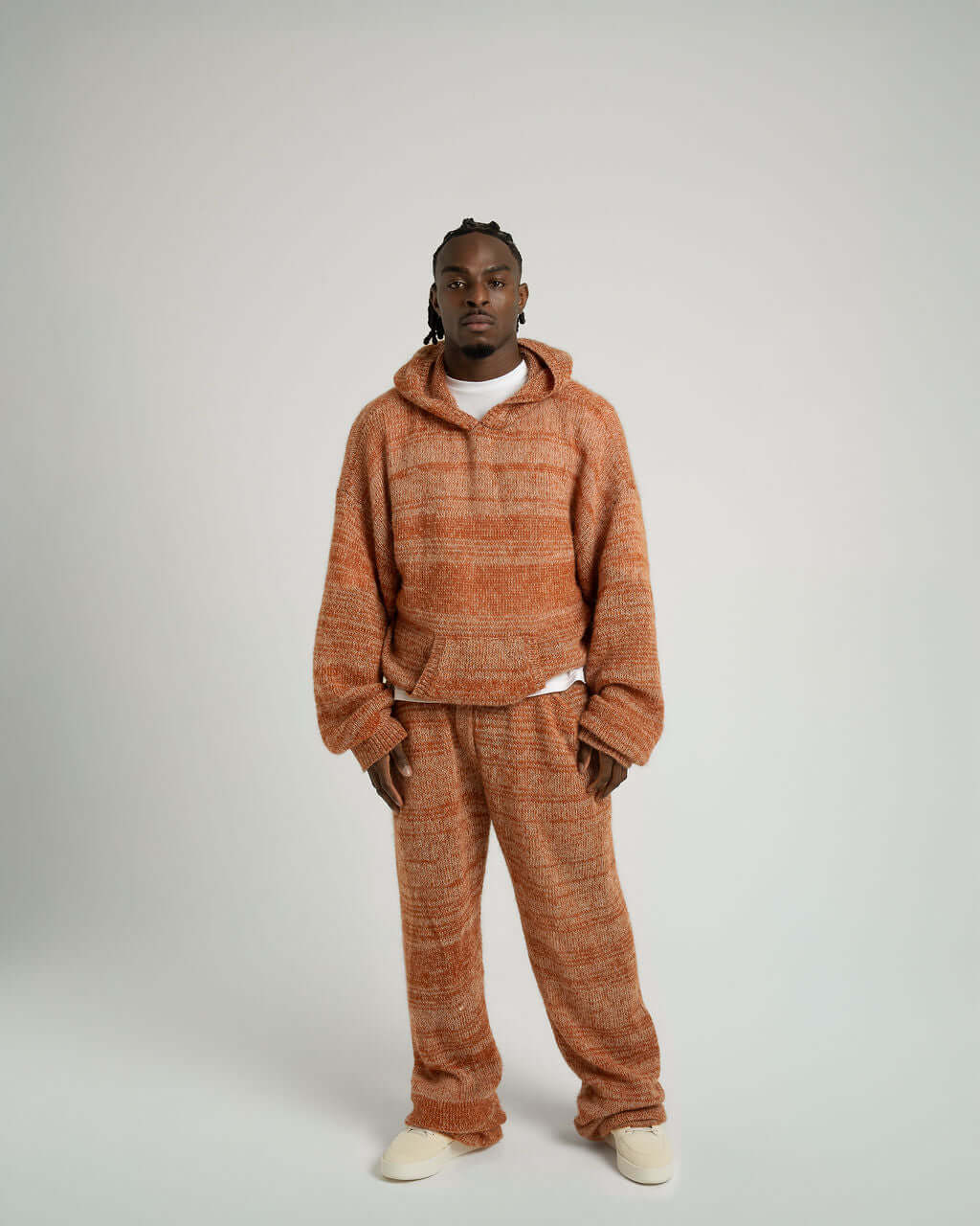 Model wearing Kid Mohair Blend Knitted Hoody in Evening Sun, showcasing oversized fit and unique striped pattern.