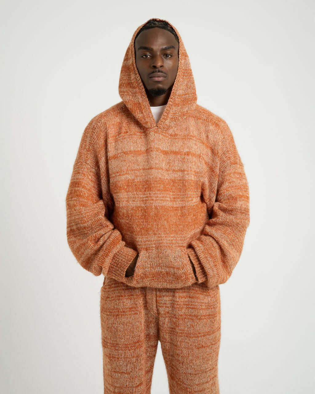 Kid Mohair Blend Knitted Hoody in Evening Sun, oversized fit with kangaroo pocket, soft blend of fibers, model wearing size L/XL.