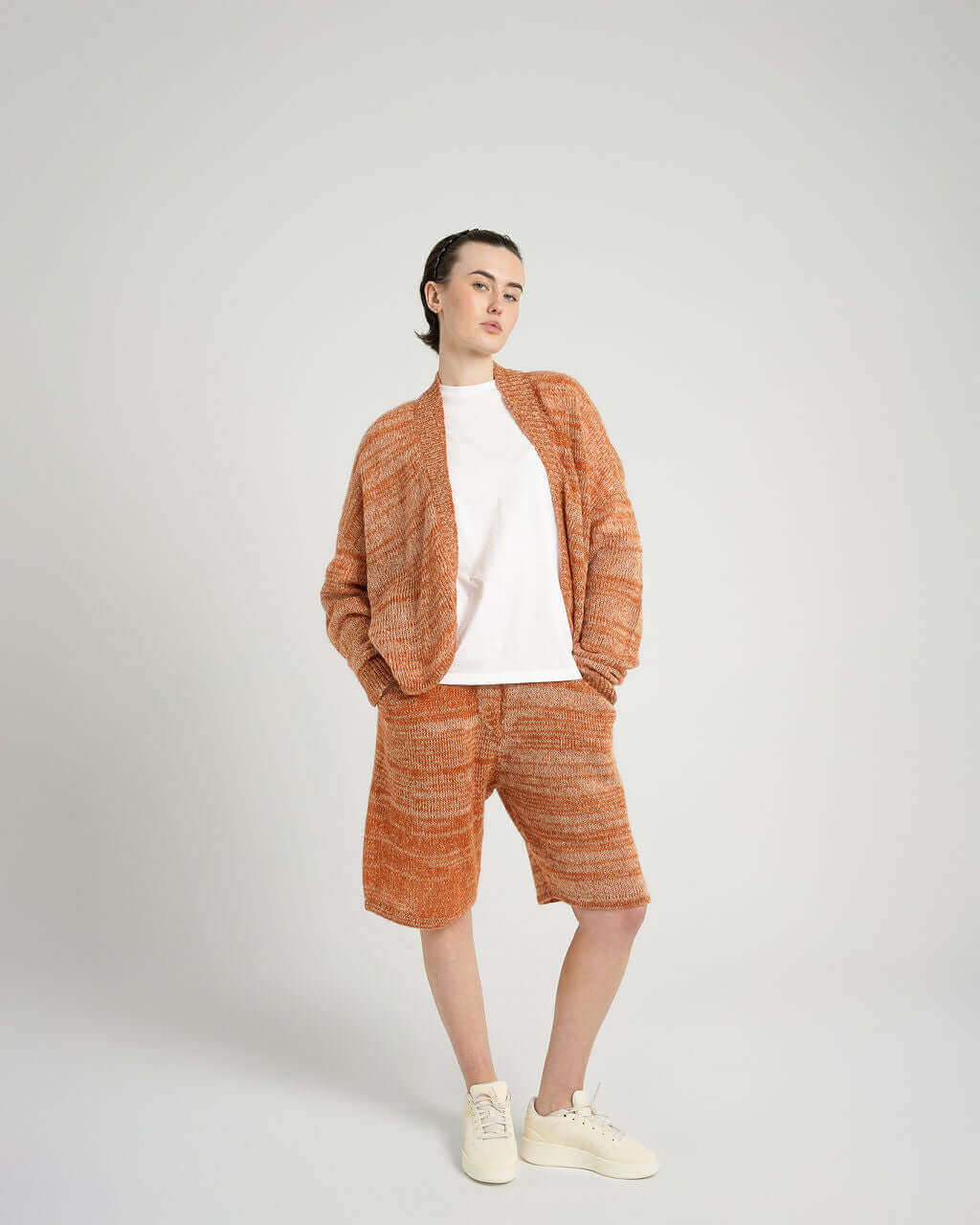 Model showcasing Kid Mohair Blend Knitted Shorts in Evening Sun, paired with a white tee and cozy cardigan.